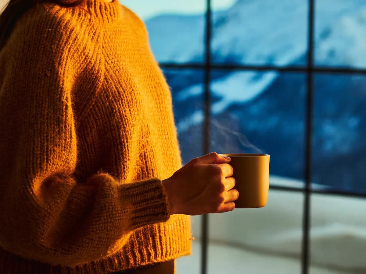 Coffee by the window on a snowy morning